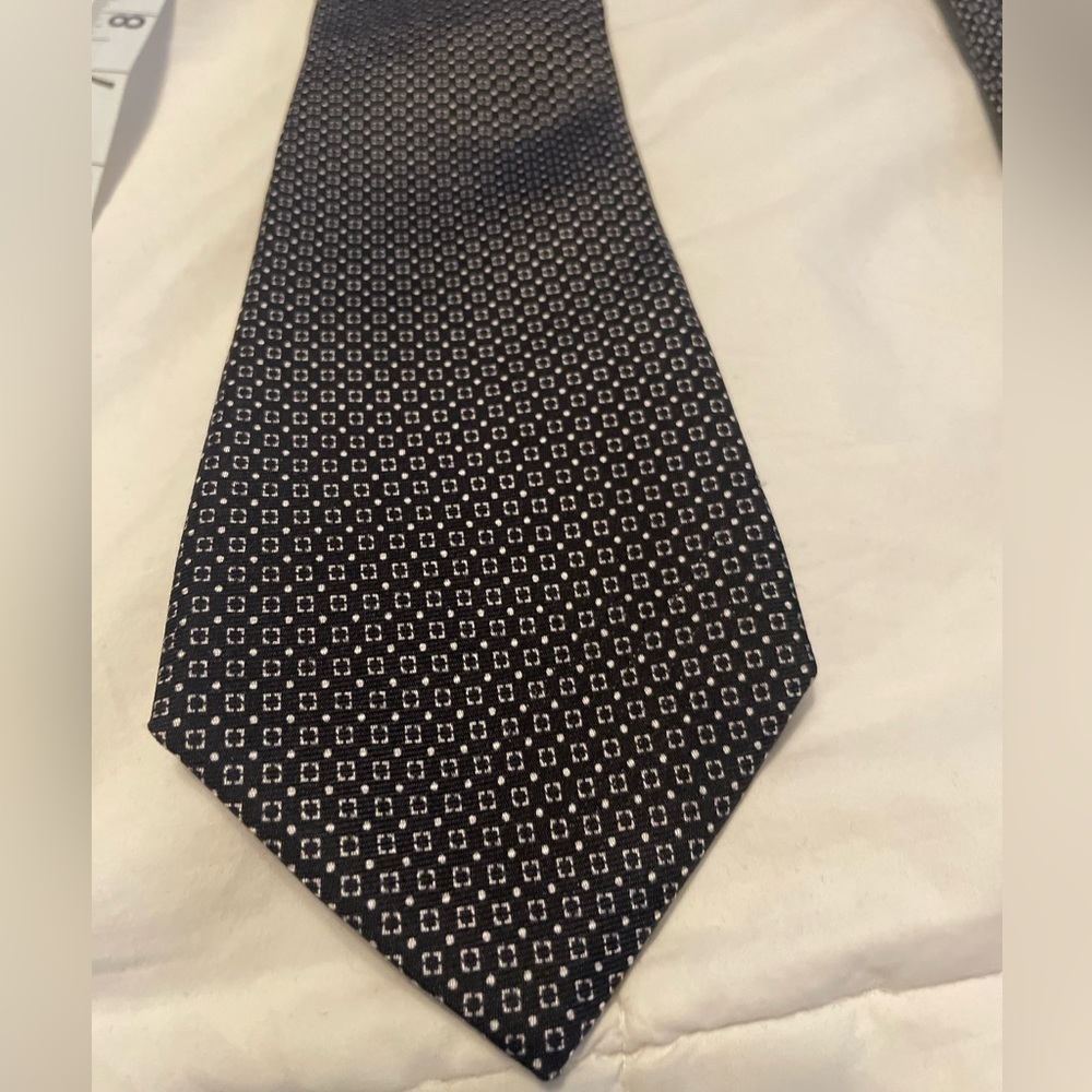100% silk black Royal Classic tie with cream geometric design. Made ion USA